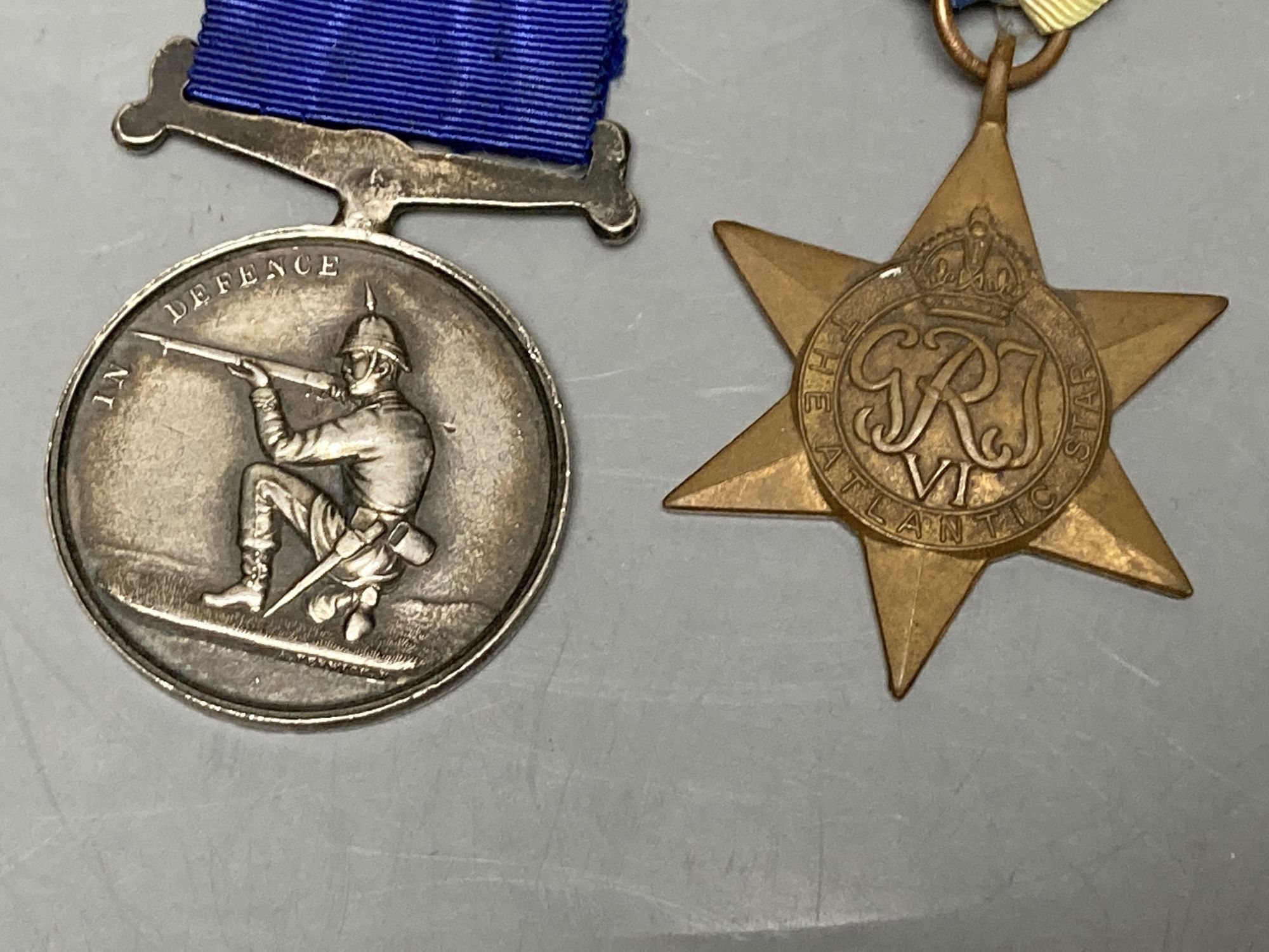 Militaria to include a Victorian Volunteer Rifles shooting medal, a WWII Atlantic Star and a plated mug engraved to 'Champion-at-Arms 1940 S/Sgt H. E. Malpas'